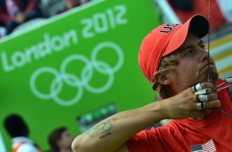 Image: A tattoo of the Olympics rings is seen o
